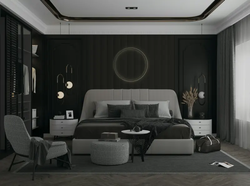 Chambre élégante aux tons sombres avec grand lit et fauteuil